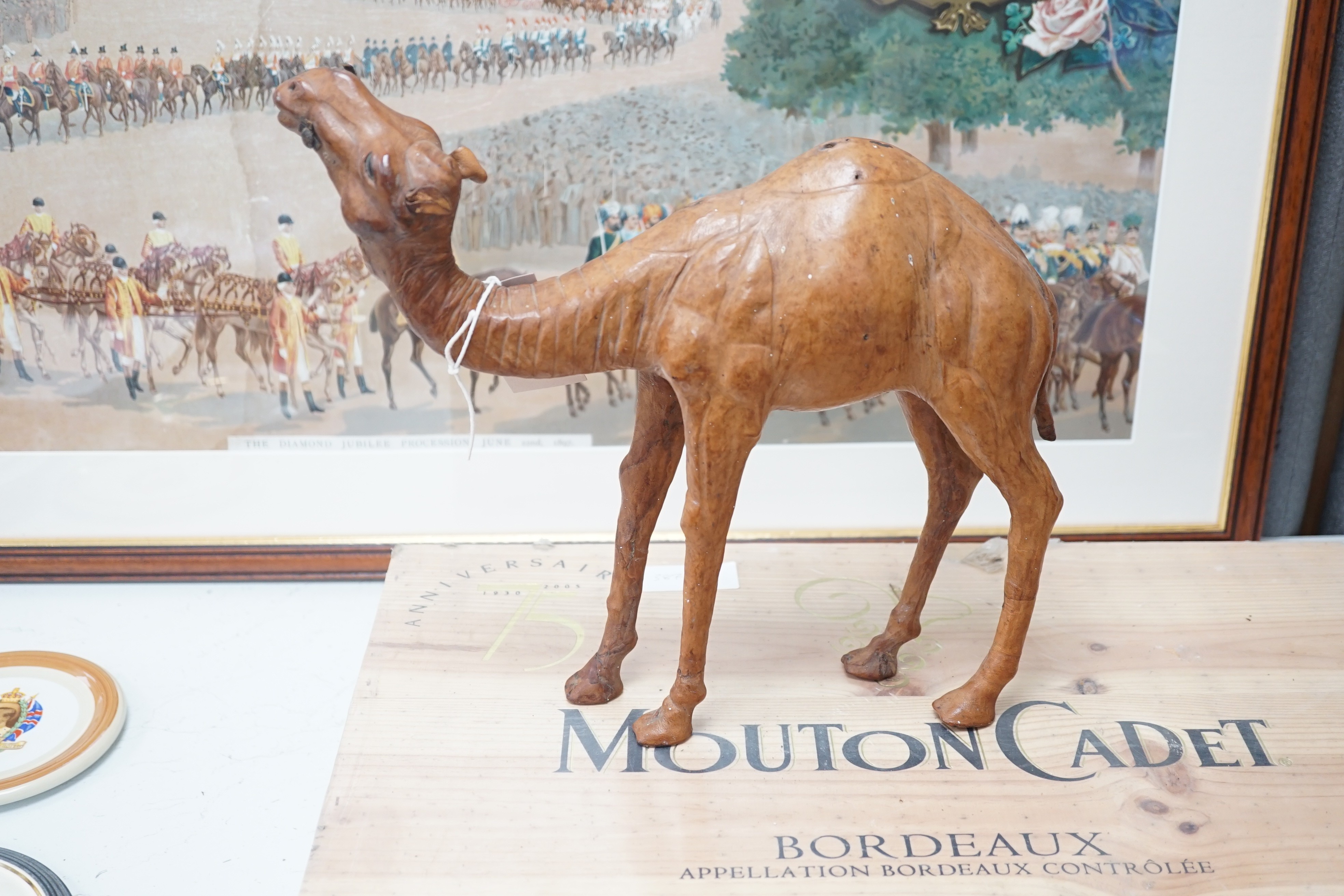 A leather covered model of a camel 32cm long